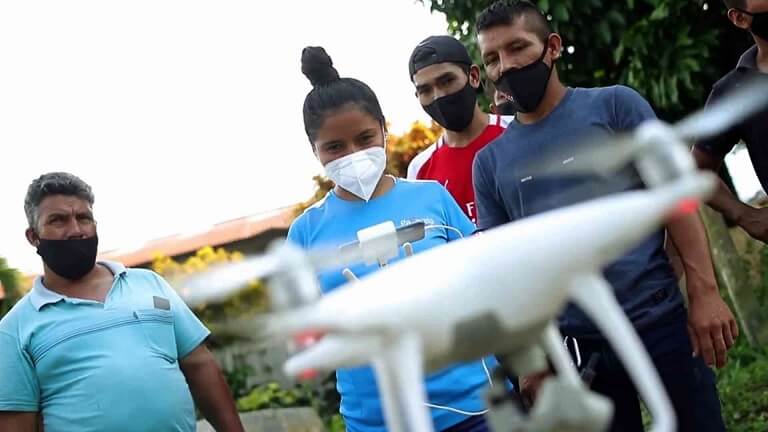 Volunteers using a drone
